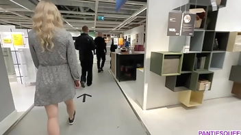 Kinky girl is stuffing anal plug in public toilet at IKEA and flashing pussy upskirt no panties publically