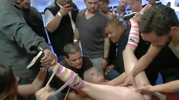 Gagged blonde is fucked in public