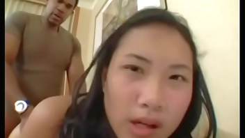 Young Thai girl Nat gets pumped full of African semen