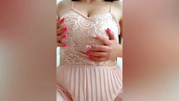 Young cutie in pink dress playing with her big tits in front of the camera - DepravedMinx