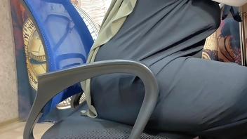 Arab woman in hijab masturbates through her panties while working