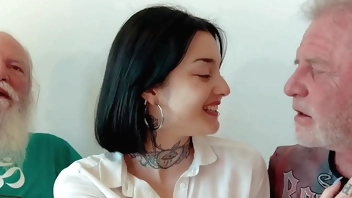 Young brunette has threesome with old men and she swallows cum