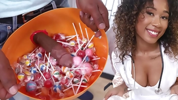 Black girl dressed with a nurse costume collecting more than just candies at this house...