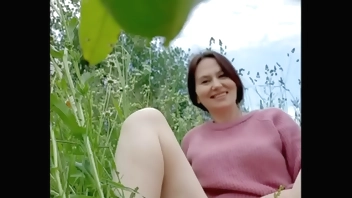 Naked horny MILF in a chamomile field masturbates, pisses and wards off a wasp / Angela-MILF