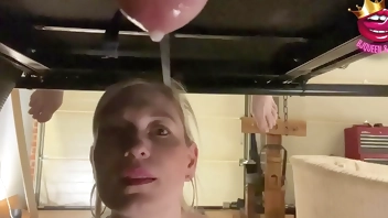 Close up ruined multiple times into a glass on milking table