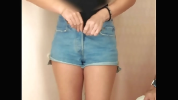 Hidden camera in changing room. Girl trying on clothes fully naked