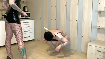 Dominatrix Nika tramples balls and dick of her slave, kicks his genitals. Femdom BDSM.