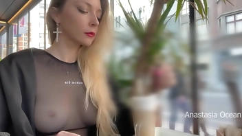 Flashing tits in cafe with glass walls so all people outside see me. Transparent t-shirt no bra.